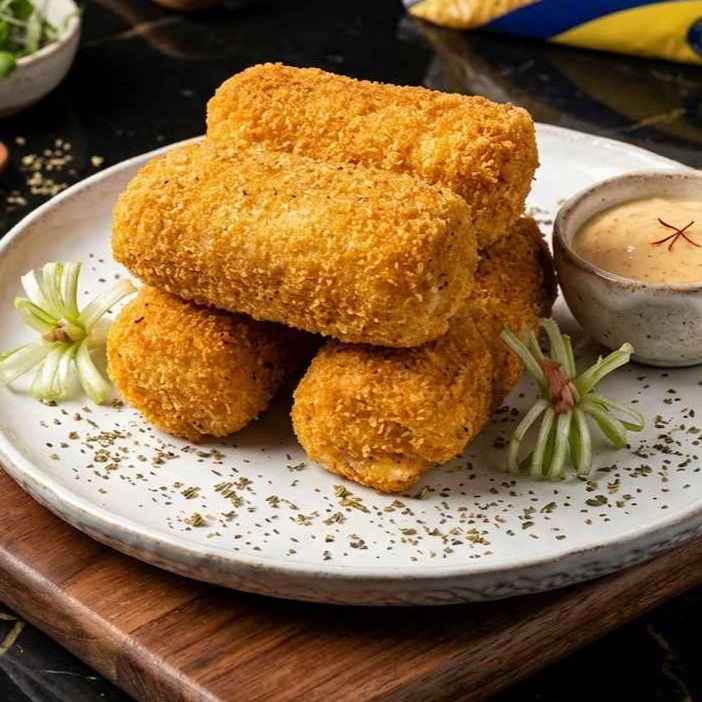 Risoles filled with smoked beef, boiled egg, and mayonnaise sauce.